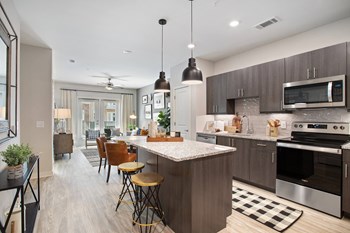 Kitchen island with lighting at The Reid Apartmients in Tucker GA